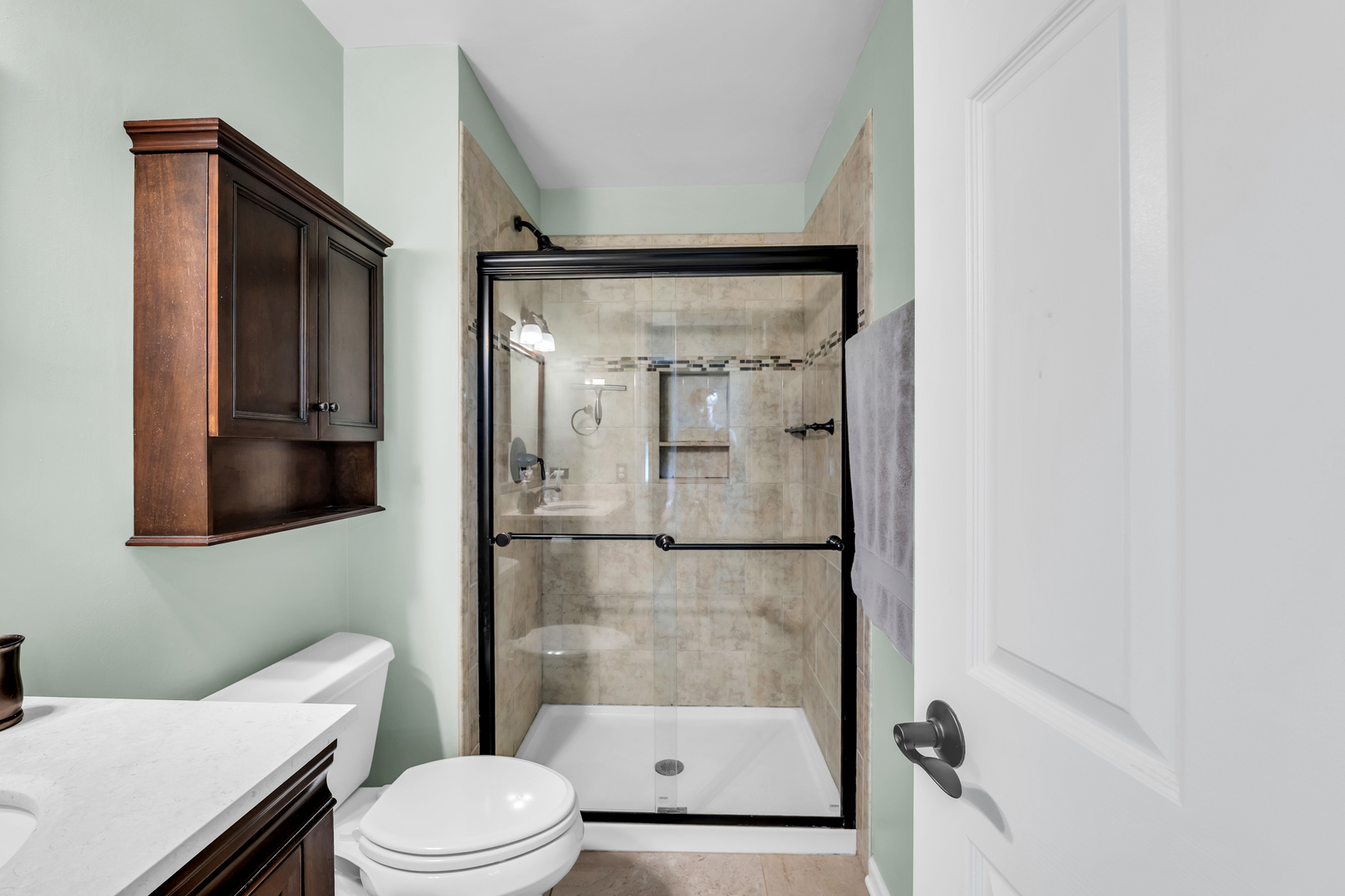 896 Chaucer Way Buffalo Grove, IL 60089 - Photo 19 of 26 a bathroom with a toilet and a shower