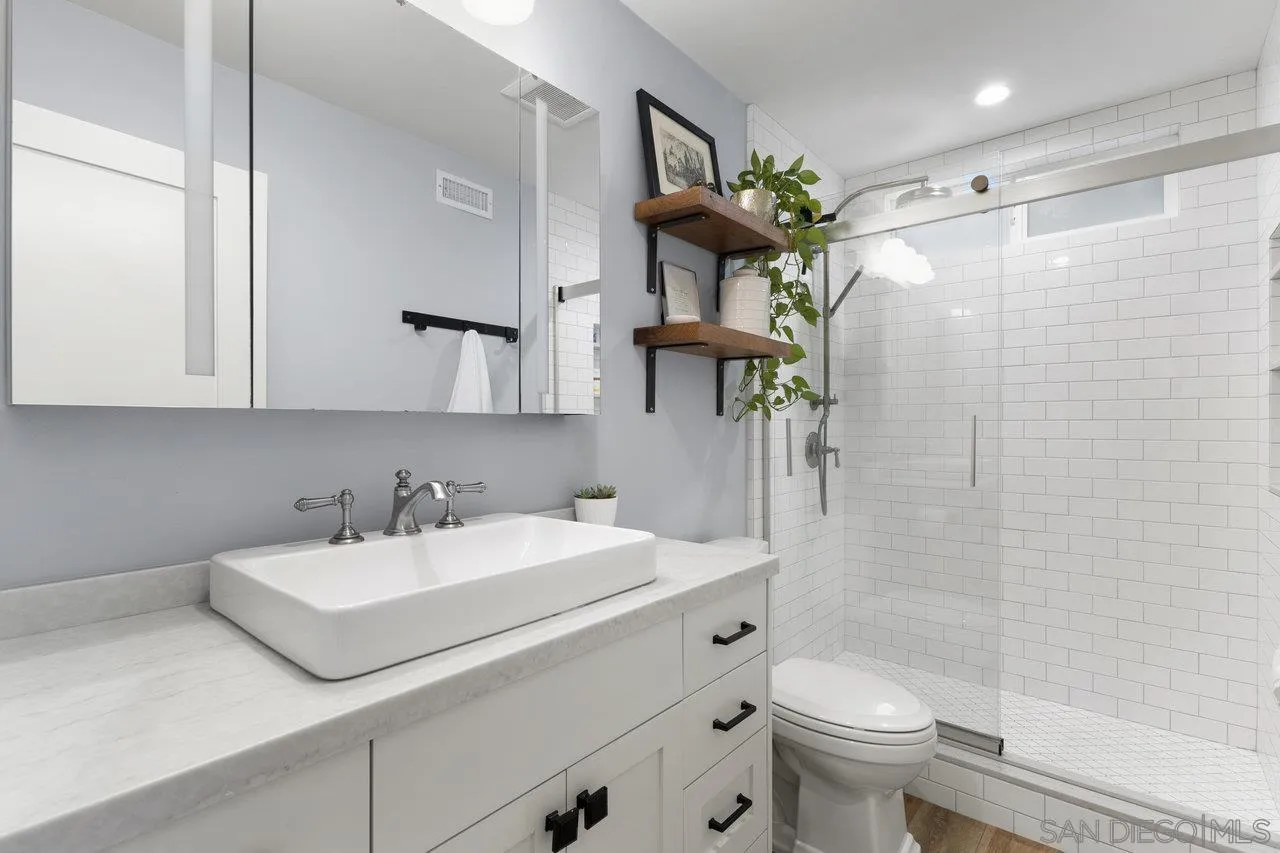 1521 Traske Road Encinitas, CA 92024 - Photo 12 of 23 a bathroom with a sink toilet and shower