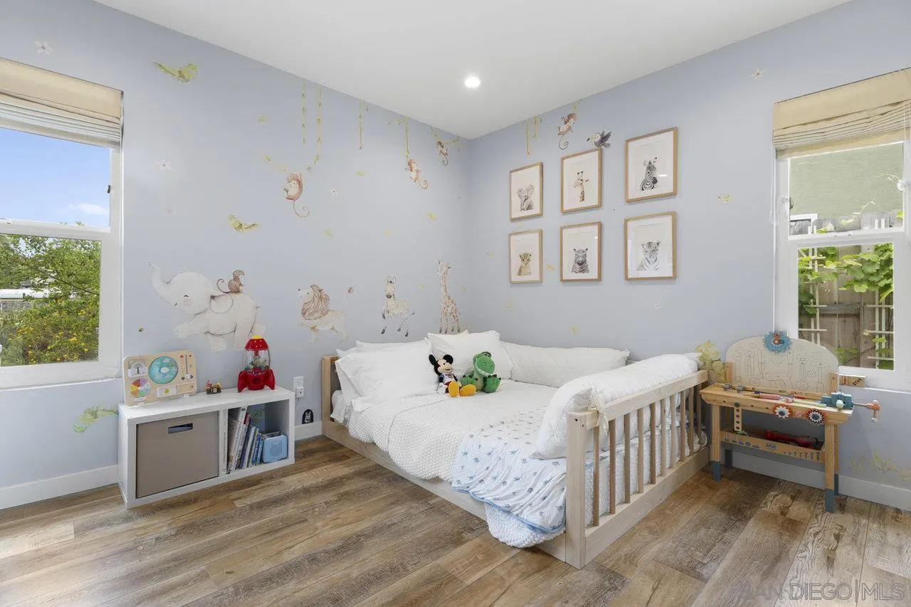 1521 Traske Road Encinitas, CA 92024 - Photo 13 of 23 a bedroom with a bed and a window