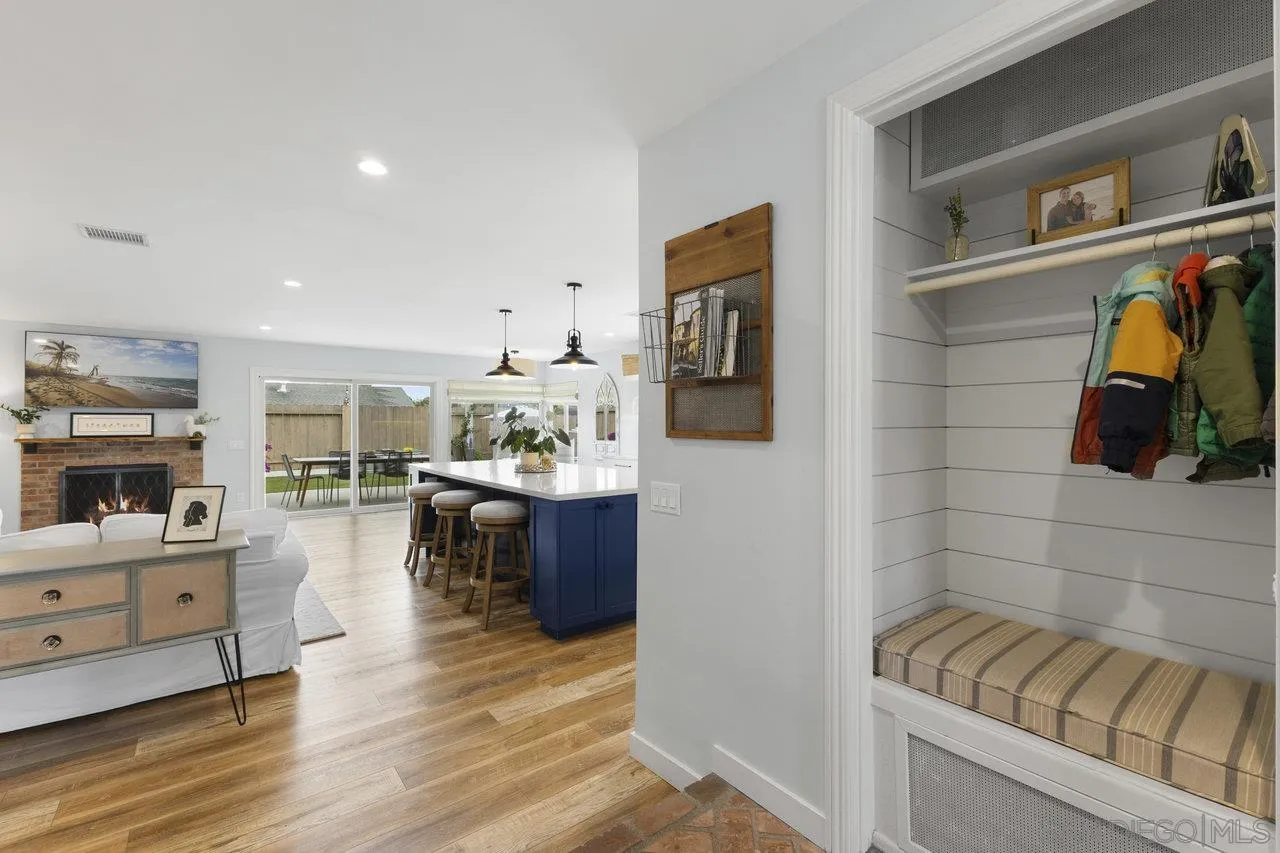 1521 Traske Road Encinitas, CA 92024 - Photo 2 of 23 a living room with furniture and a kitchen view