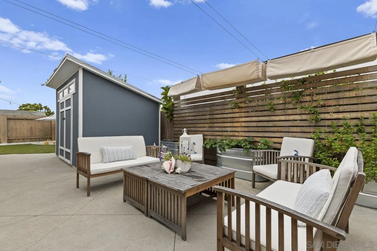 1521 Traske Road Encinitas, CA 92024 - Photo 22 of 23 a view of a patio with a table and chairs