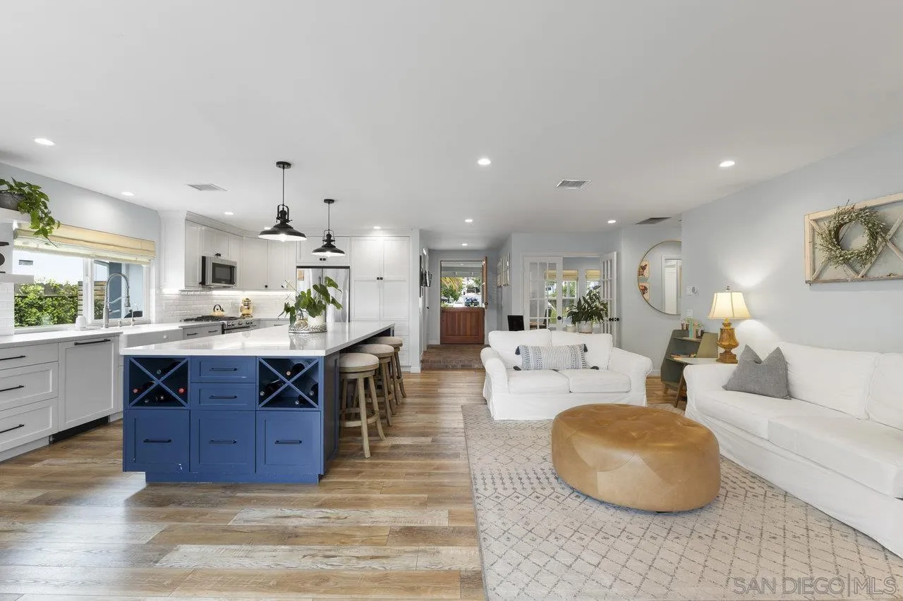 1521 Traske Road Encinitas, CA 92024 - Photo 4 of 23 a living room with furniture a wooden floor and kitchen view