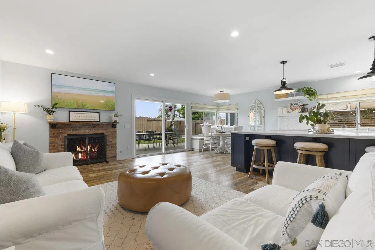 1521 Traske Road Encinitas, CA 92024 - Photo 7 of 23 a living room with furniture potted plant and a fireplace