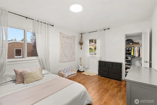 a bedroom with a bed and a dresser