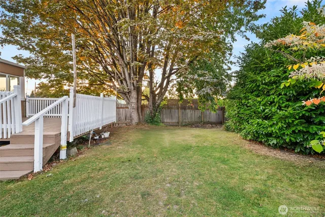 a backyard of a house with lots of green space