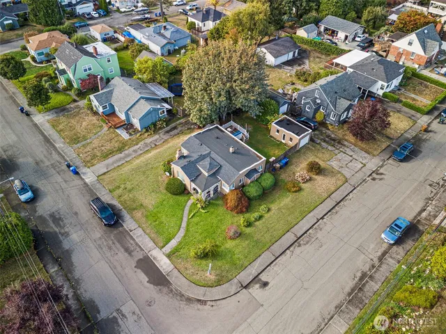 an aerial view of a residential houses with outdoor space