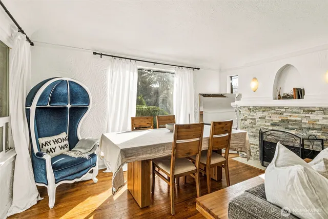 a view of a livingroom with furniture and a fireplace