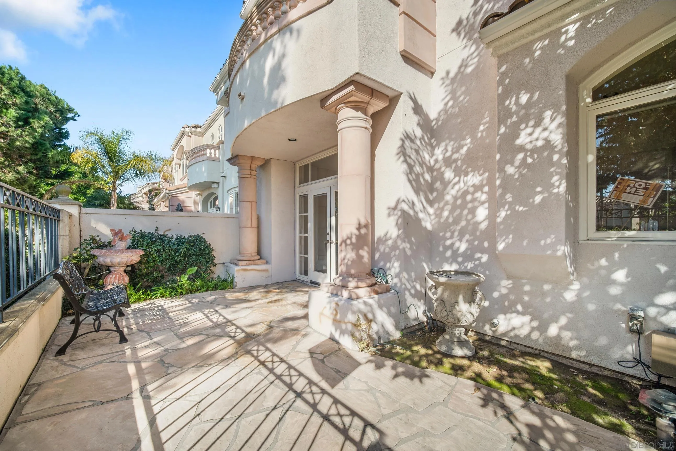 5380 Renaissance Avenue San Diego, CA 92122 - Photo 13 of 25 a view of a house with a patio