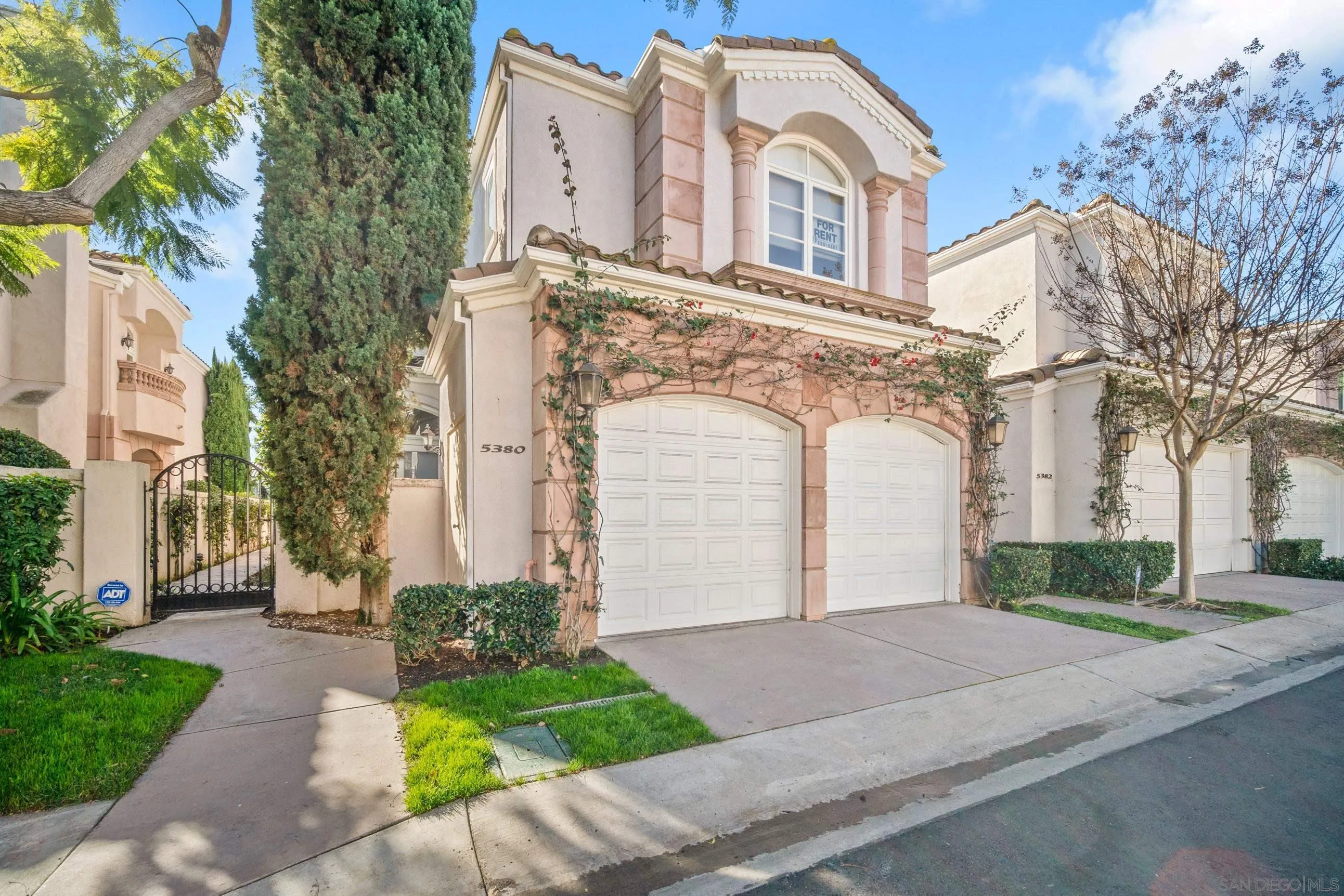 5380 Renaissance Avenue San Diego, CA 92122 - Photo 2 of 25 a front view of a building with garden