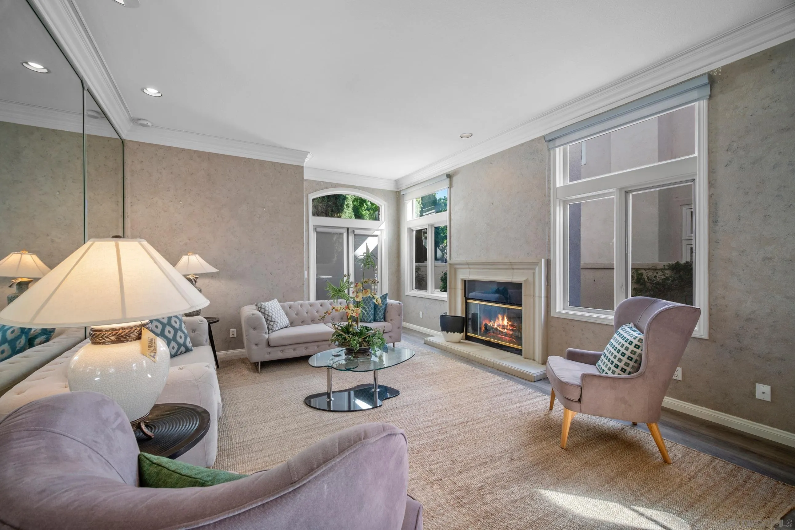 5380 Renaissance Avenue San Diego, CA 92122 - Photo 4 of 25 a living room with furniture and a fireplace