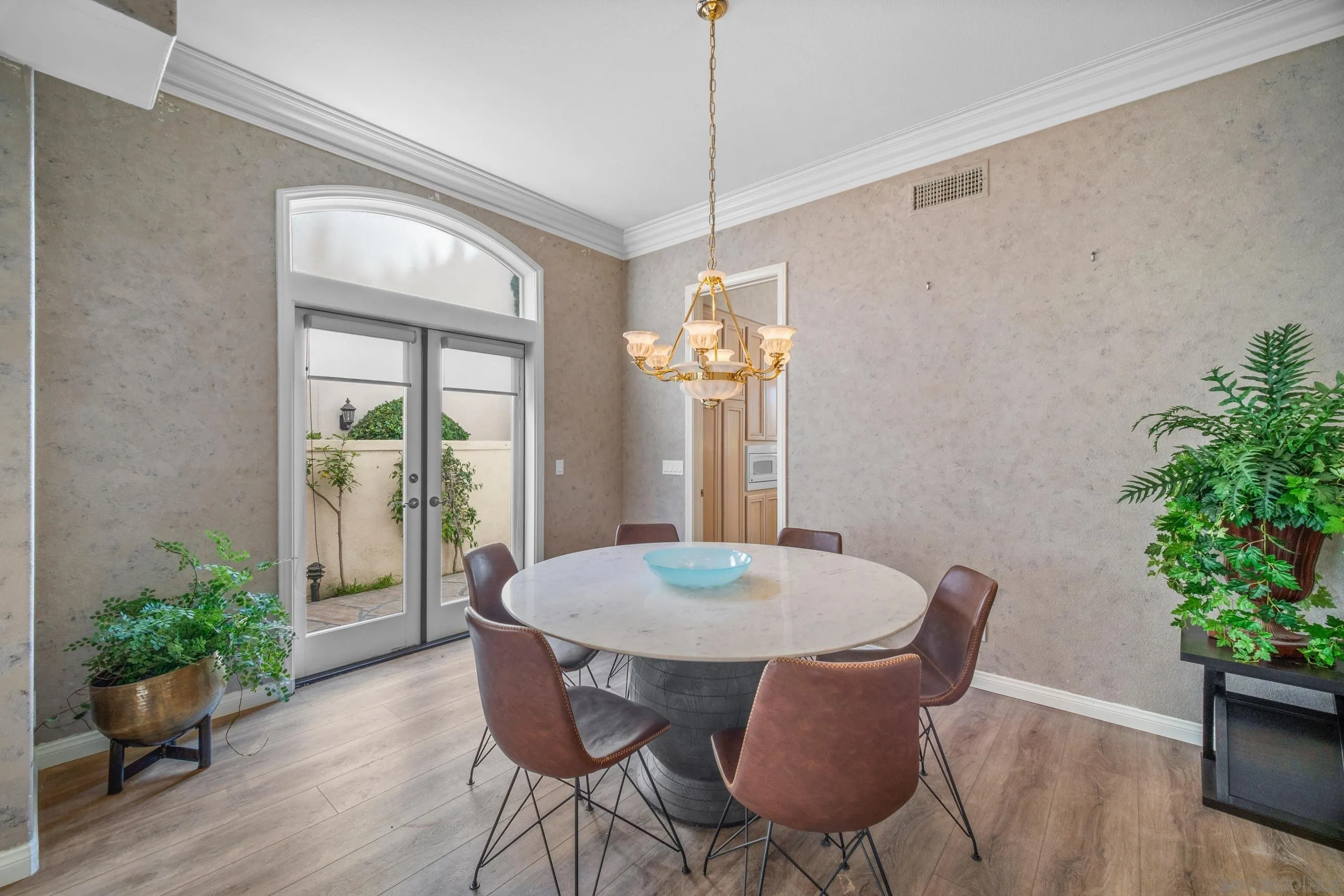 5380 Renaissance Avenue San Diego, CA 92122 - Photo 5 of 25 a view of a dining room with furniture window and wooden floor