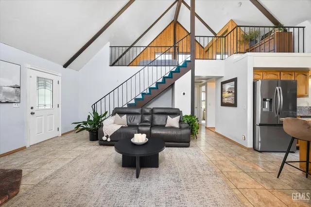 a view of an entryway and livingroom with furniture