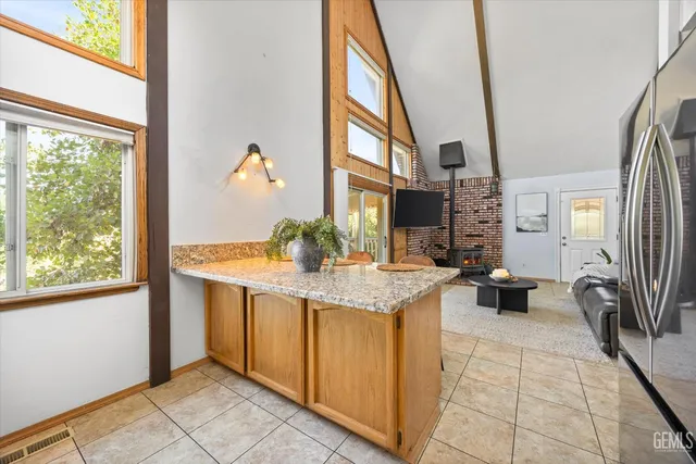 a bedroom with a bed chair and window