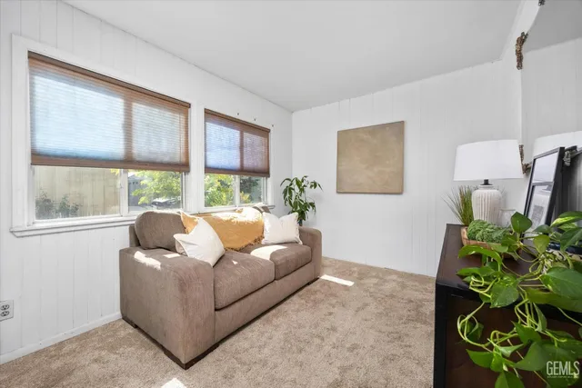 a bed room with a bed and a lamp