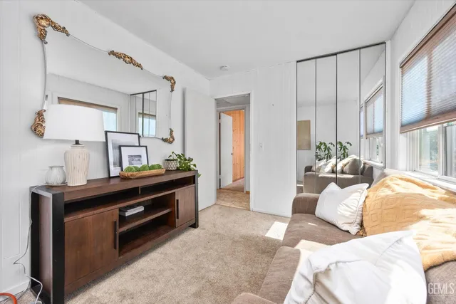 a view of living room with furniture and a window
