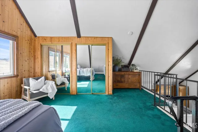 a bedroom with bed and a window