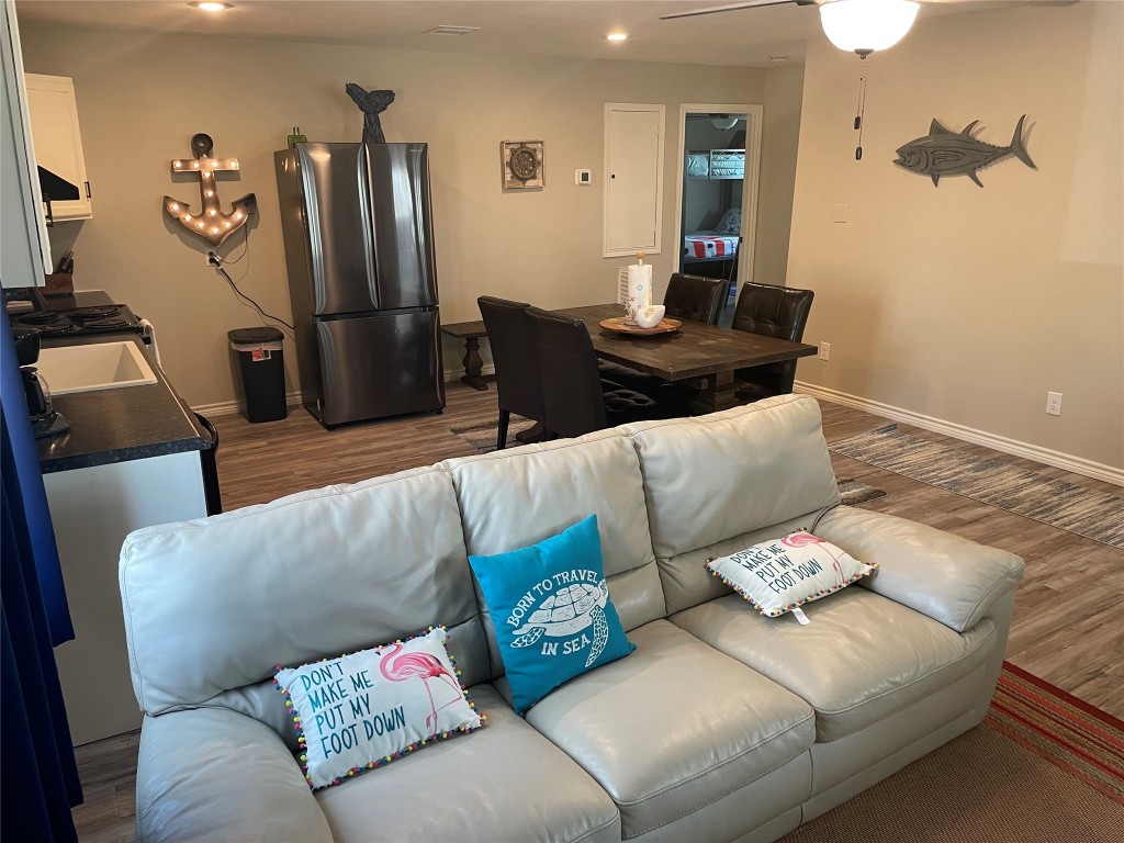 1016 Hardee Street Rockport, TX 78382 - Photo 11 of 14 a living room with furniture and a flat screen tv