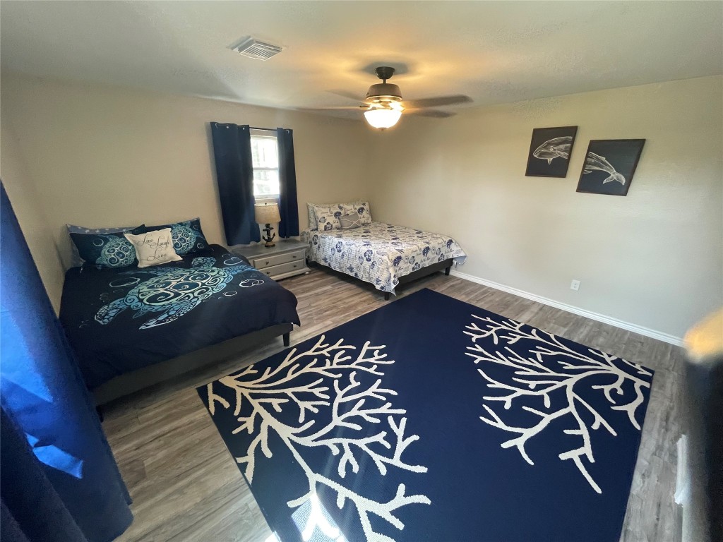 1016 Hardee Street Rockport, TX 78382 - Photo 14 of 14 a bedroom with bed and balcony