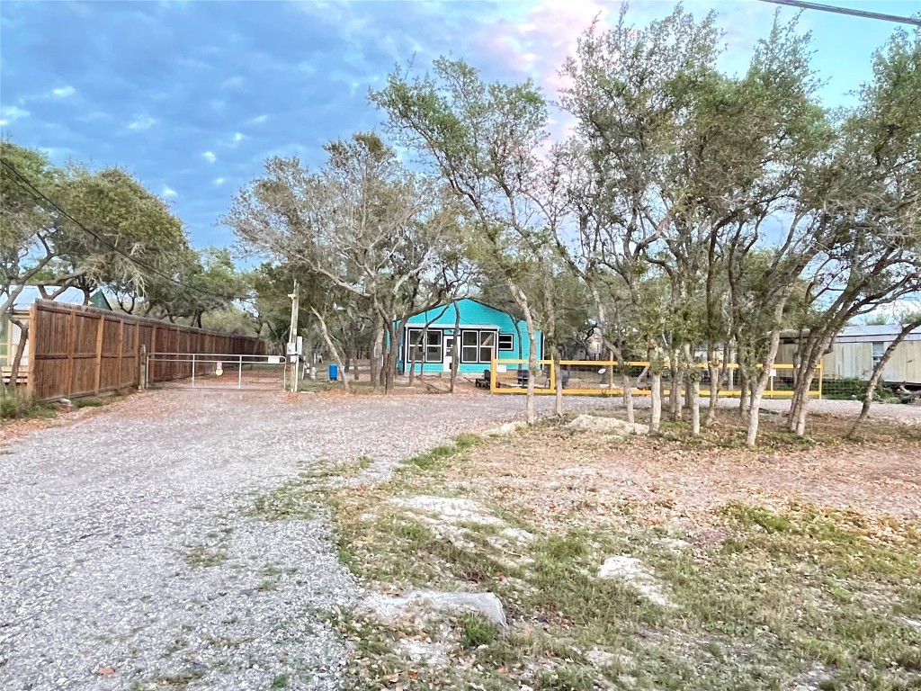 1016 Hardee Street Rockport, TX 78382 - Photo 2 of 14 a house with trees in front of it