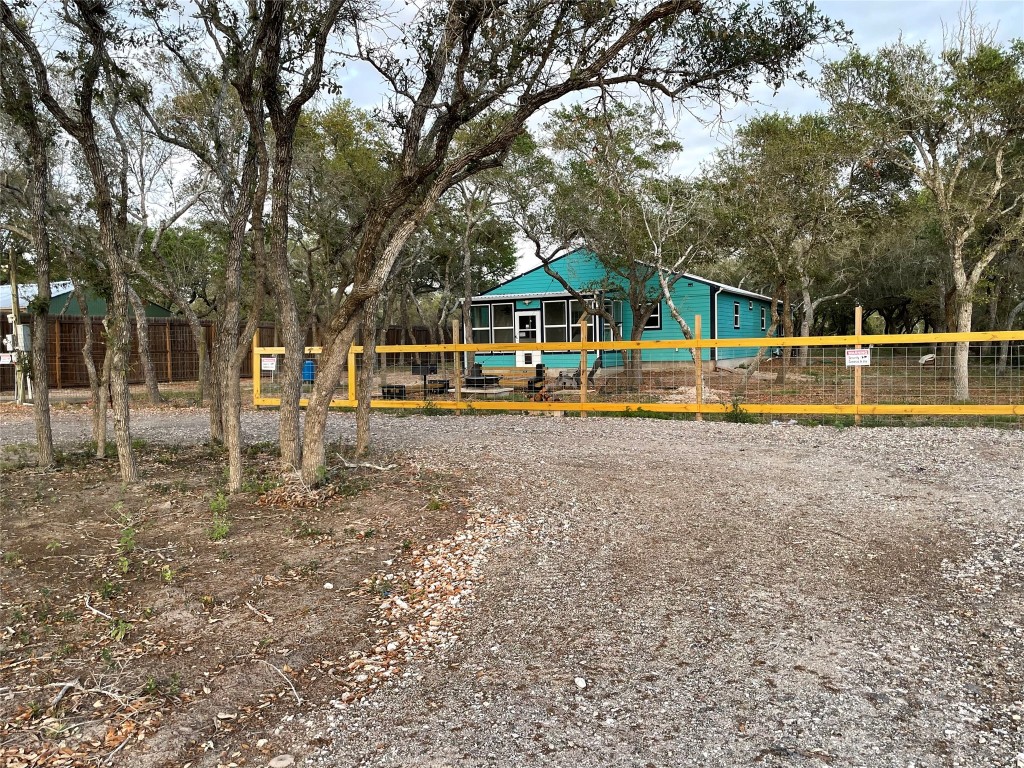 1016 Hardee Street Rockport, TX 78382 - Photo 3 of 14 a view of a house with a yard and sitting area