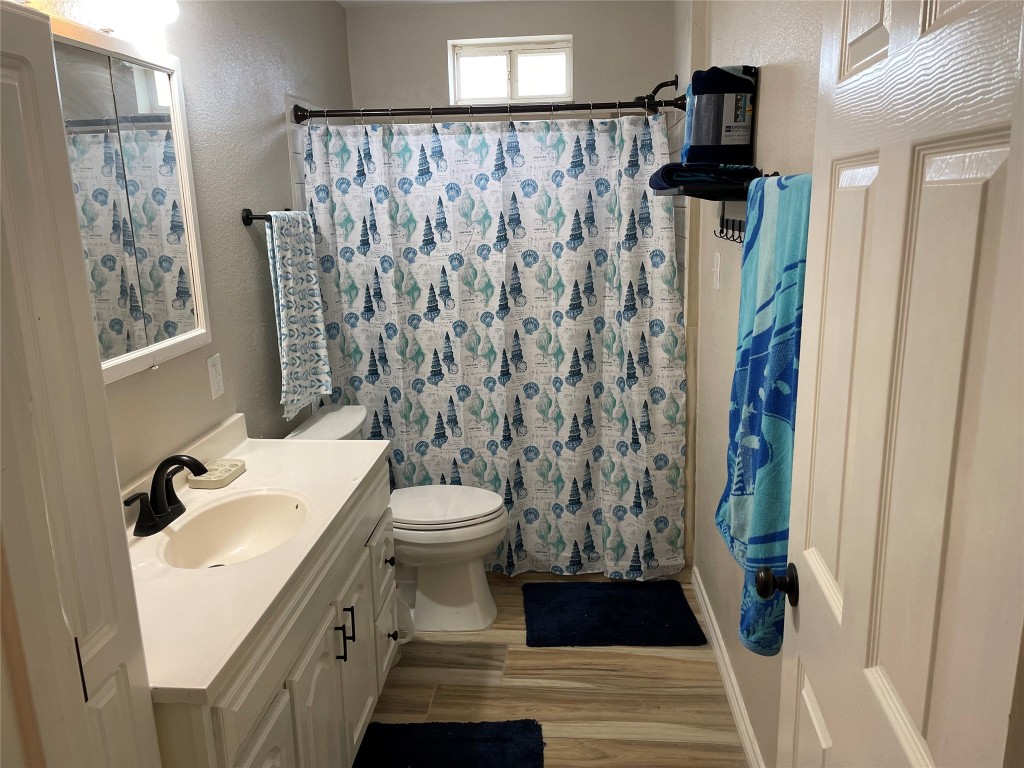 1016 Hardee Street Rockport, TX 78382 - Photo 8 of 14 a bathroom with a sink and toilet