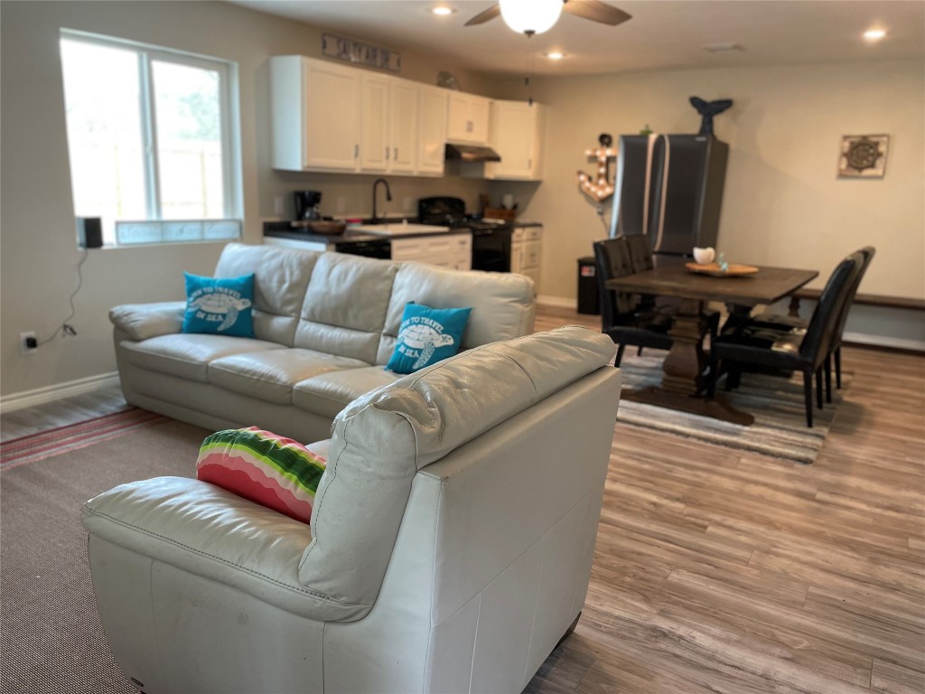 1016 Hardee Street Rockport, TX 78382 - Photo 9 of 14 a living room with furniture and a wooden floor