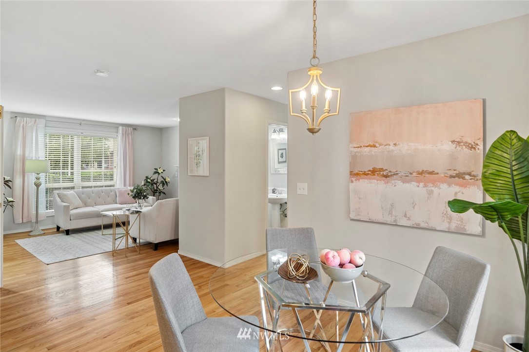 5112 Northeast 20th Street Renton, WA 98059 - Photo 14 of 40 a living room with furniture dining table and a chandelier