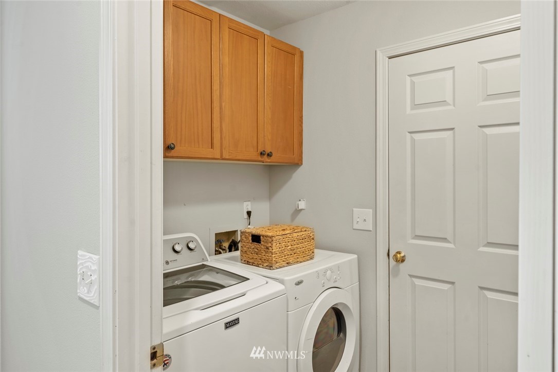 5112 Northeast 20th Street Renton, WA 98059 - Photo 16 of 40 a view of storage and utility room with washer and dryer