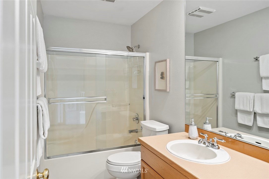 5112 Northeast 20th Street Renton, WA 98059 - Photo 25 of 40 a bathroom with a sink toilet and shower