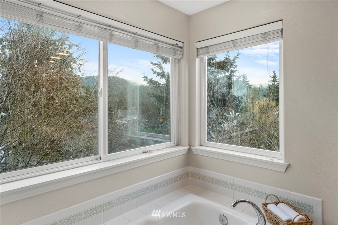 5112 Northeast 20th Street Renton, WA 98059 - Photo 31 of 40 a bathroom with a shower and a window
