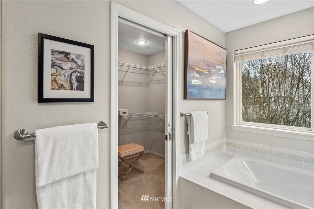 5112 Northeast 20th Street Renton, WA 98059 - Photo 32 of 40 a bathroom with a bathtub and a shower