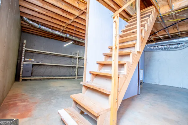 a view of a room with wooden walls