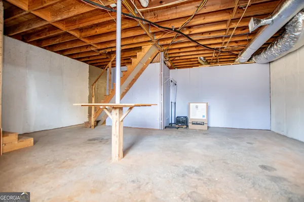 a view of a room with wooden walls
