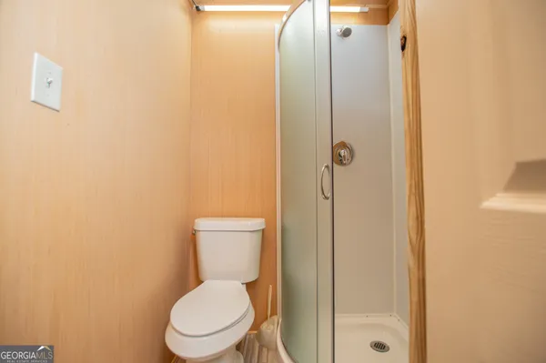 a view of a backyard with a chair and table