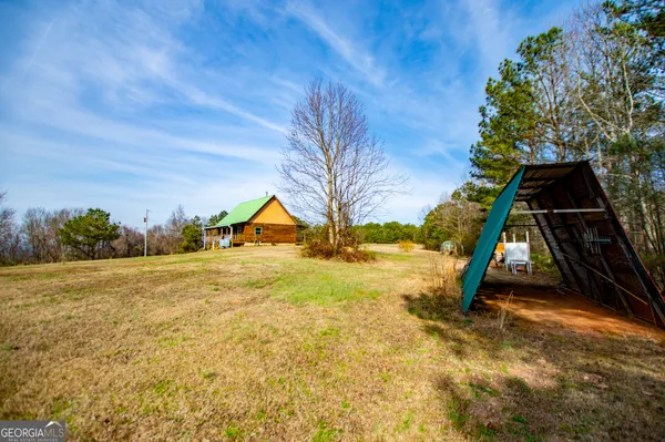 a view of a water pond with green space