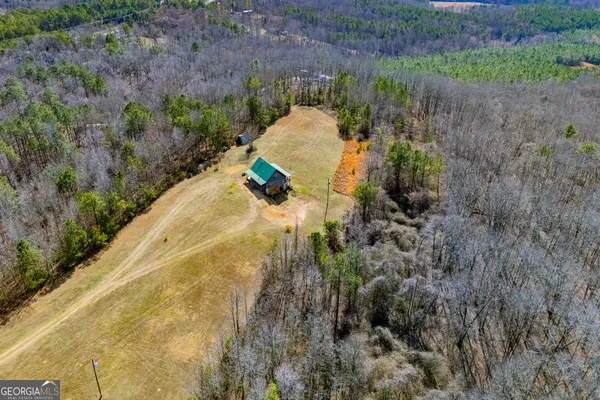 an aerial view of residential house with outdoor space