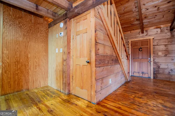 a view of a livingroom with furniture window and wooden floor