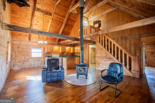 a view of a living room and kitchen