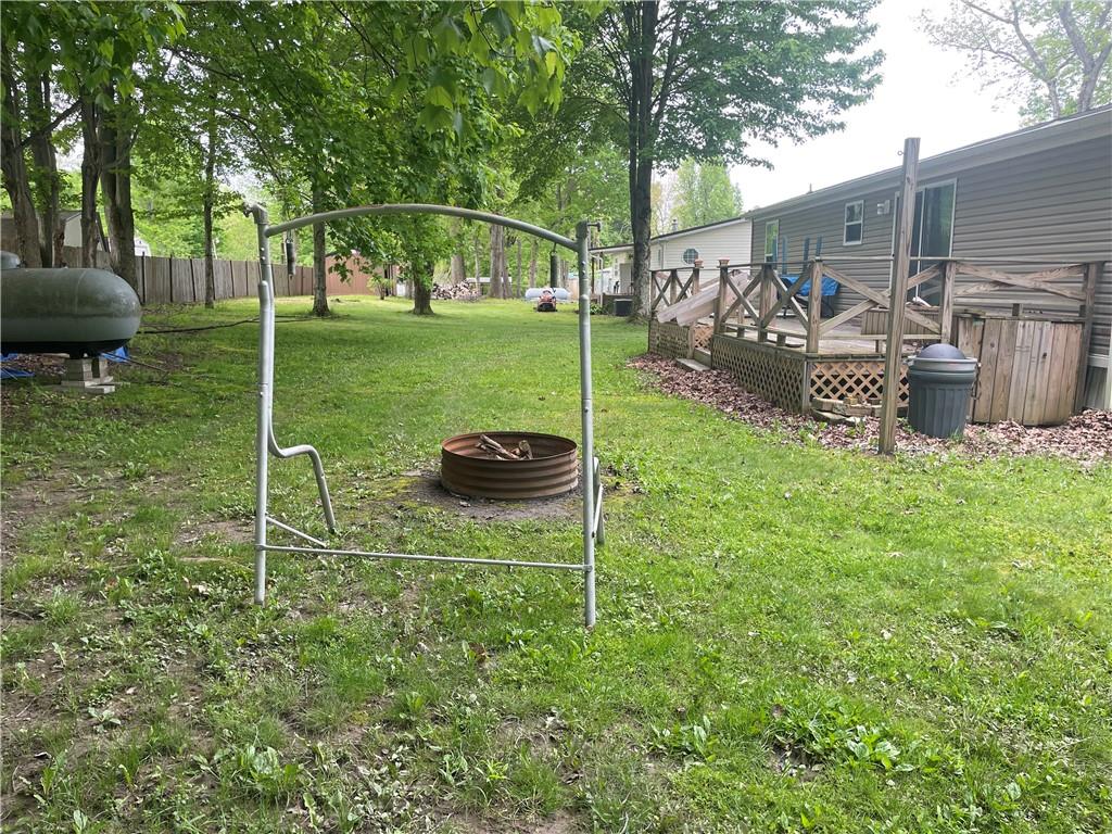 14624 Gilliland Road Linesville, PA 16424 - Photo 9 of 23 a backyard of a house with table and chairs