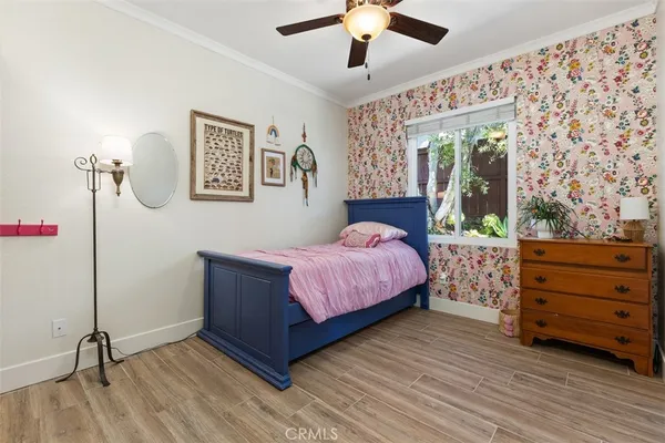 a bed room with a bed and a window