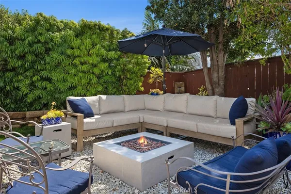 a outdoor space with patio the couches and a umbrella