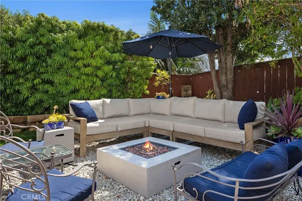 a outdoor space with patio the couches and a umbrella