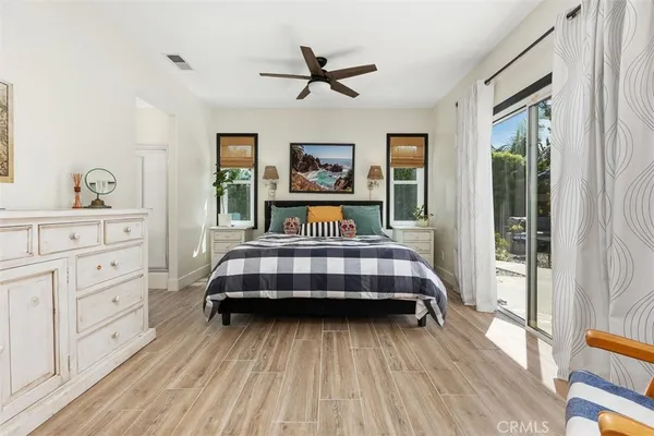 a bedroom with a bed and window