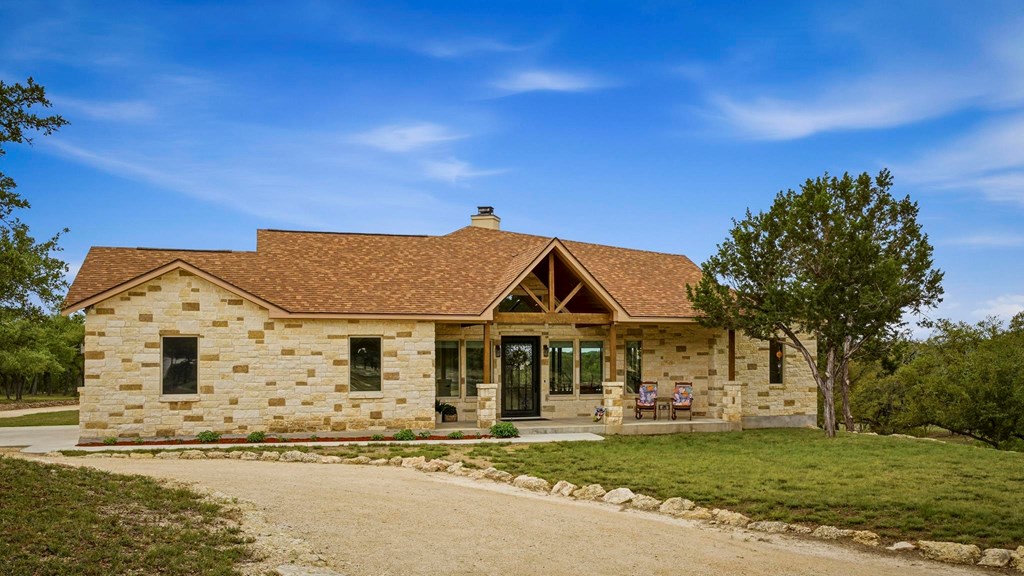 134 North Stallion Ests Drive Spring Branch, TX 78070 - Photo 2 of 67 a front view of a house with a garden