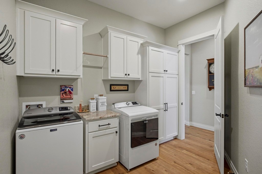 134 North Stallion Ests Drive Spring Branch, TX 78070 - Photo 21 of 67 a kitchen with stainless steel appliances granite countertop a sink and a refrigerator
