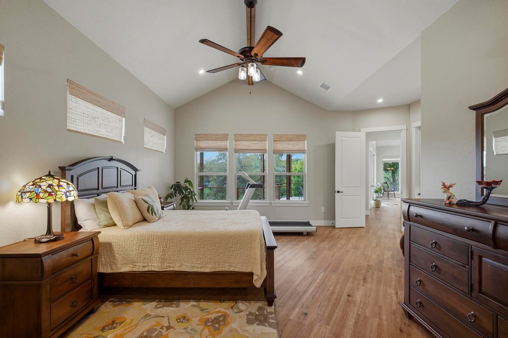 134 North Stallion Ests Drive Spring Branch, TX 78070 - Photo 24 of 67 a bedroom with a large bed and a large window