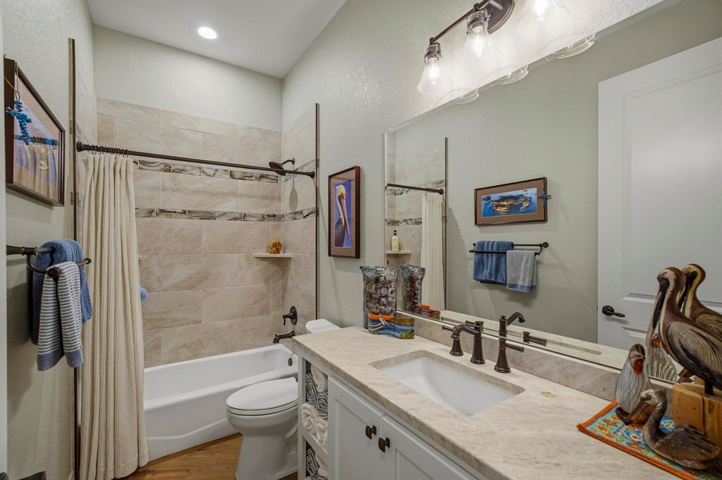 134 North Stallion Ests Drive Spring Branch, TX 78070 - Photo 28 of 67 a bathroom with a granite countertop sink toilet and shower