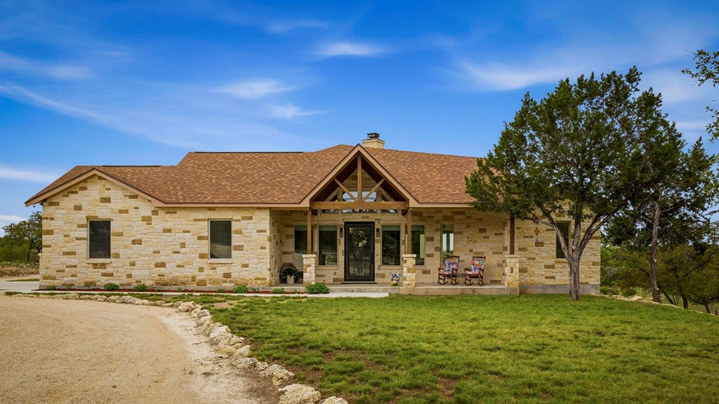 134 North Stallion Ests Drive Spring Branch, TX 78070 - Photo 3 of 67 a front view of a house with garden