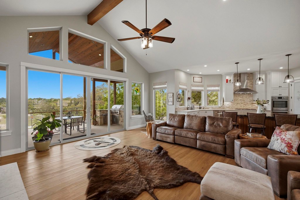 134 North Stallion Ests Drive Spring Branch, TX 78070 - Photo 6 of 67 a living room with furniture ceiling fan and a large window