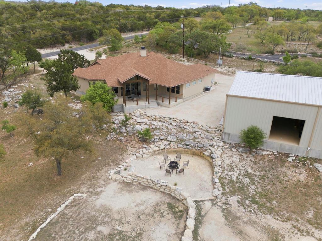 134 North Stallion Ests Drive Spring Branch, TX 78070 - Photo 64 of 67 an aerial view of a house with a yard and mountain
